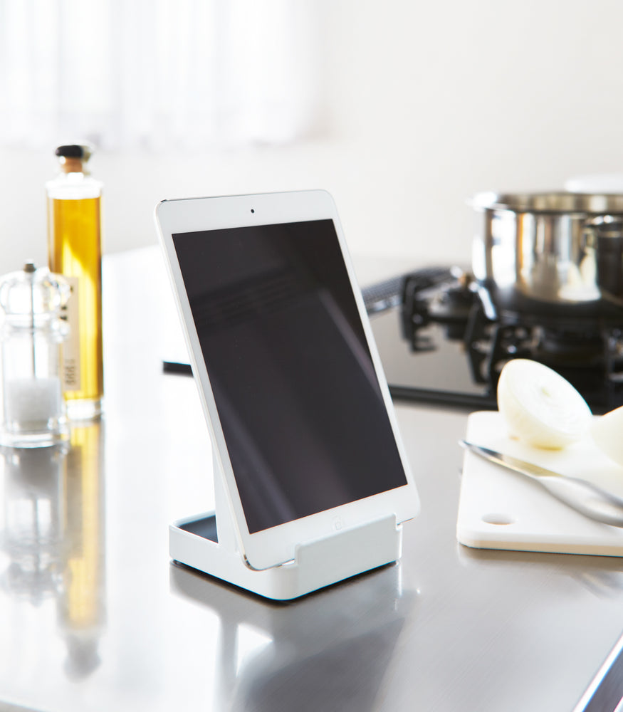 View 3 - White Lid & Ladle Stand displaying tablet on kitchen countertop by Yamazaki Home.