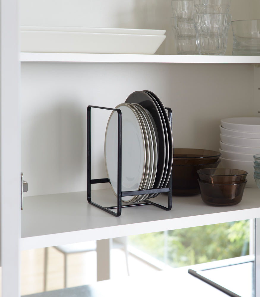 View 6 - Black Dish Storage Rack holding plates in cabinet by Yamazaki Home.
