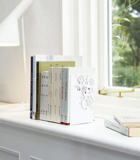 White Bookends holding books on shelf by Yamazaki Home. view 2