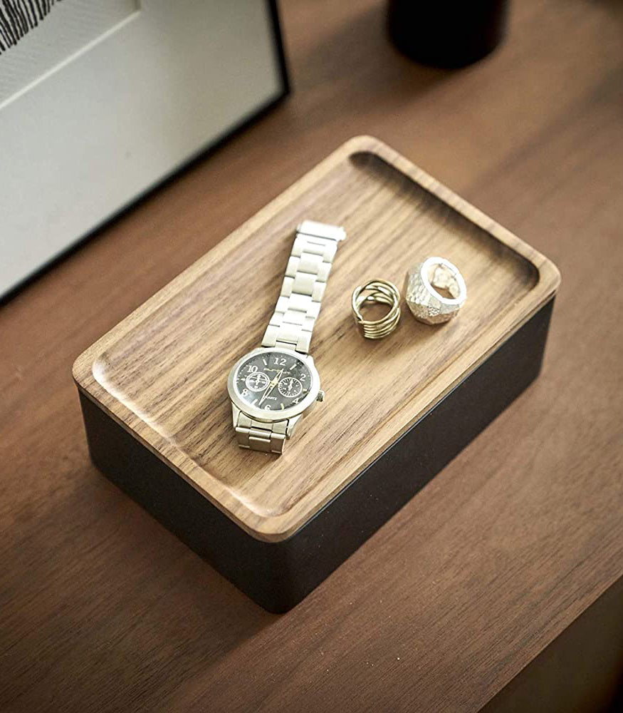 View 12 - Aerial view of black Accessory Box with Wood Lid displaying watch and rings by Yamazaki Home.