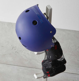 Aerial close up view of white Kids' Helmet Stand holding helemt and bag by Yamazaki Home. view 5