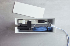 Aerial view of white Rolling Cable Management Rack holding power strip by Yamazaki Home. view 6