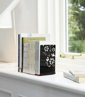 Black Bookends holding books on shelf by Yamazaki Home. view 4