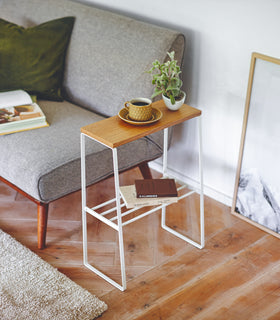 White End Table holding books, cup, and plant in living room by Yamazaki Home. view 2