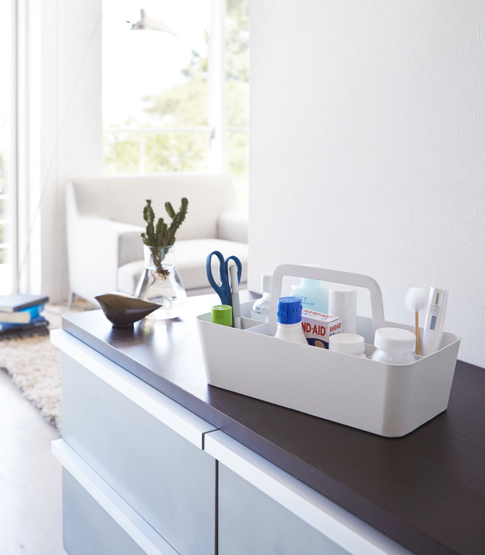 White Storage Caddy containing medical items by Yamazaki Home.