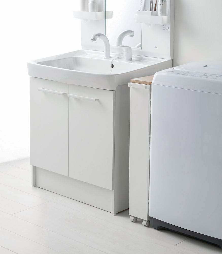 View 6 - Side view of white Rolling Storage Cart in bathroom by Yamazaki Home.