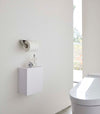 White Wall-Mount Storage on bathroom wall by Yamazaki Home.
