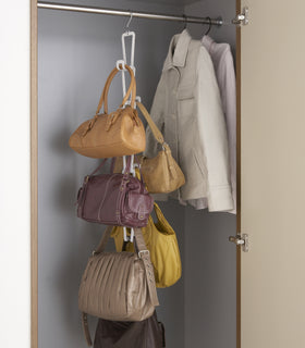 White Chain Link Bag Hanger holding purses in closet by Yamazaki Home. view 3