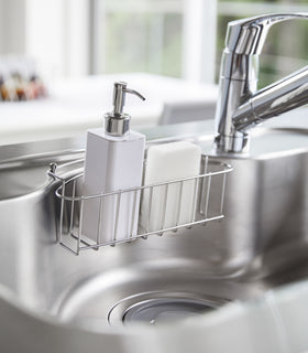 White Hand Soap Dispenser in kitchen sink by Yamazaki Home. view 3