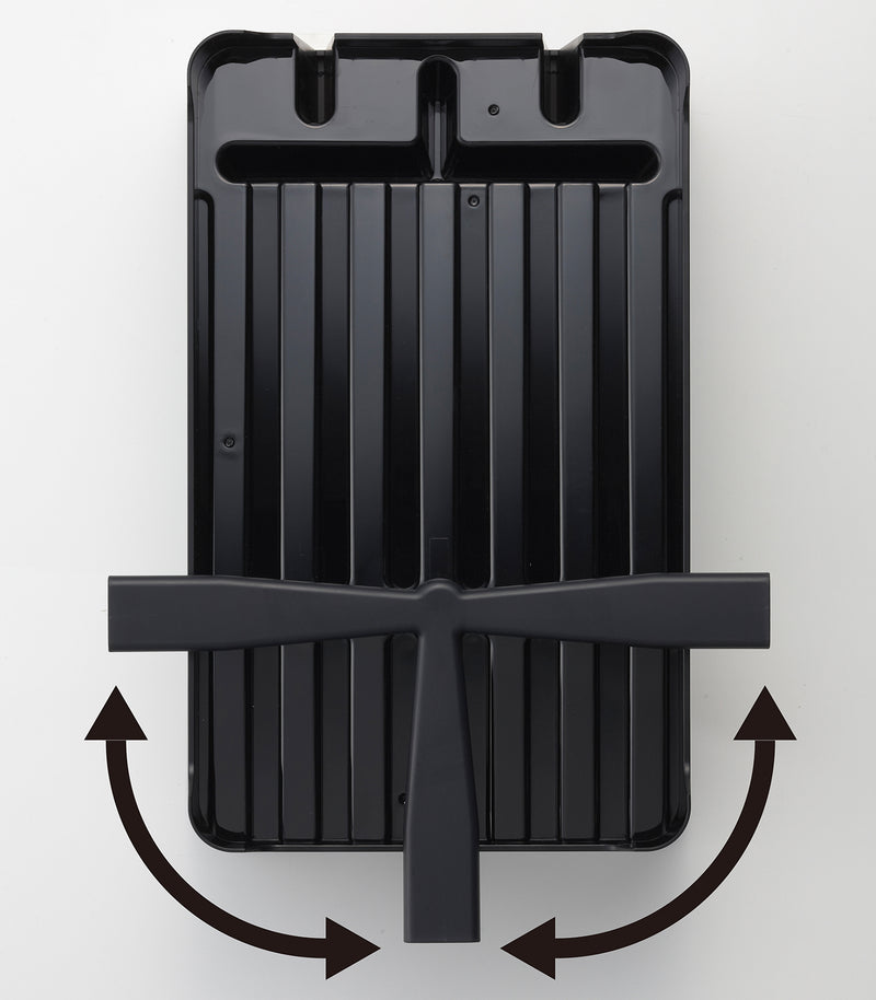 Underneath view of black Dish Rack undercarriage and draining spout by Yamazaki Home.