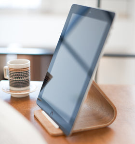 Close up view of Ash Tablet Stand displaying tablet on table by Yamazaki Home. view 3