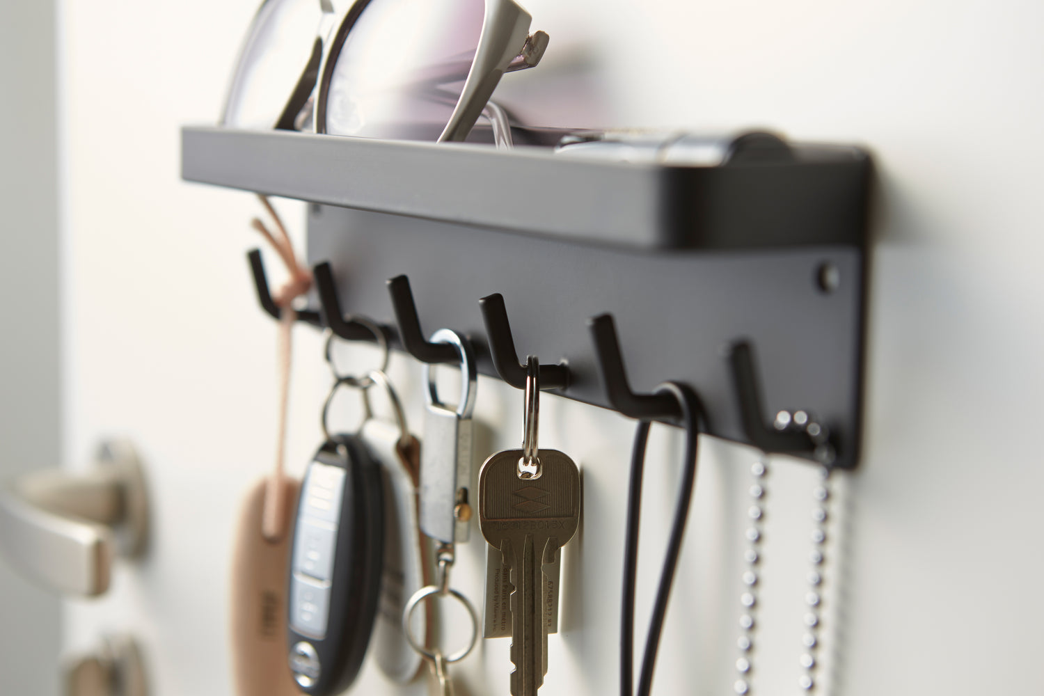 View 12 - Black Magnetic Key Rack with Tray holding sunglasses and keys by Yamazaki Home.