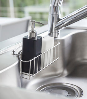 Side view of black Hand Soap Dispenser in kitchen sink by Yamazaki Home. view 9