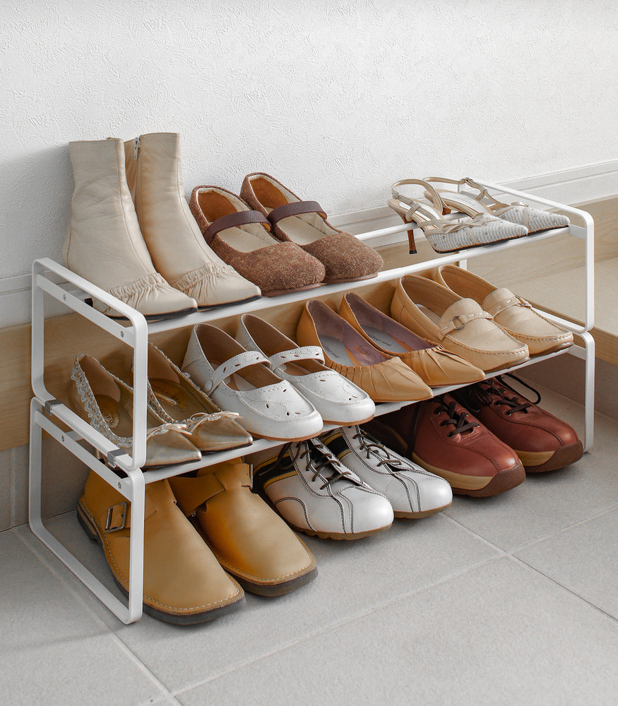 View 3 - White entryway Stackable Shoe Rack holding shoes by Yamazaki Home.