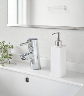 White Hand Soap Dispenser on bathroom counter by Yamazaki Home. view 2