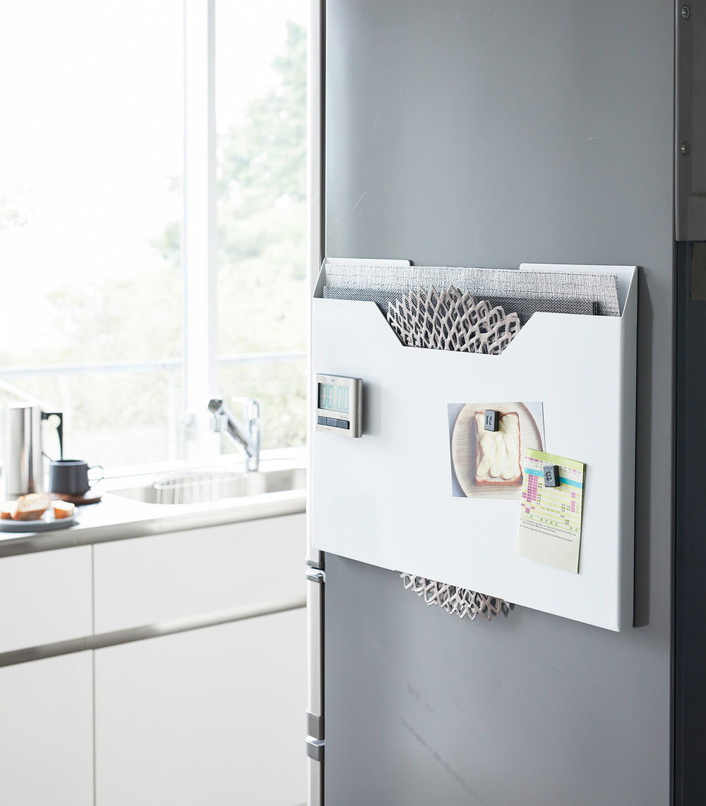 White Magnetic Placemat Organizer on kitchen fridge by Yamazaki home.