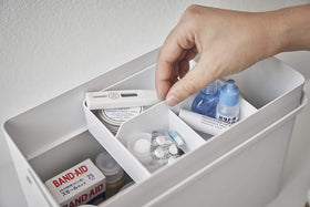 Close up view of white Sewing Kit Organizer holding first-aid materials by Yamazaki Home. view 6