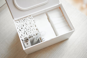 Aerial view of white Skincare Organizer holding cotton pads, cotton tips, and nail utensils by Yamazaki Home. view 4