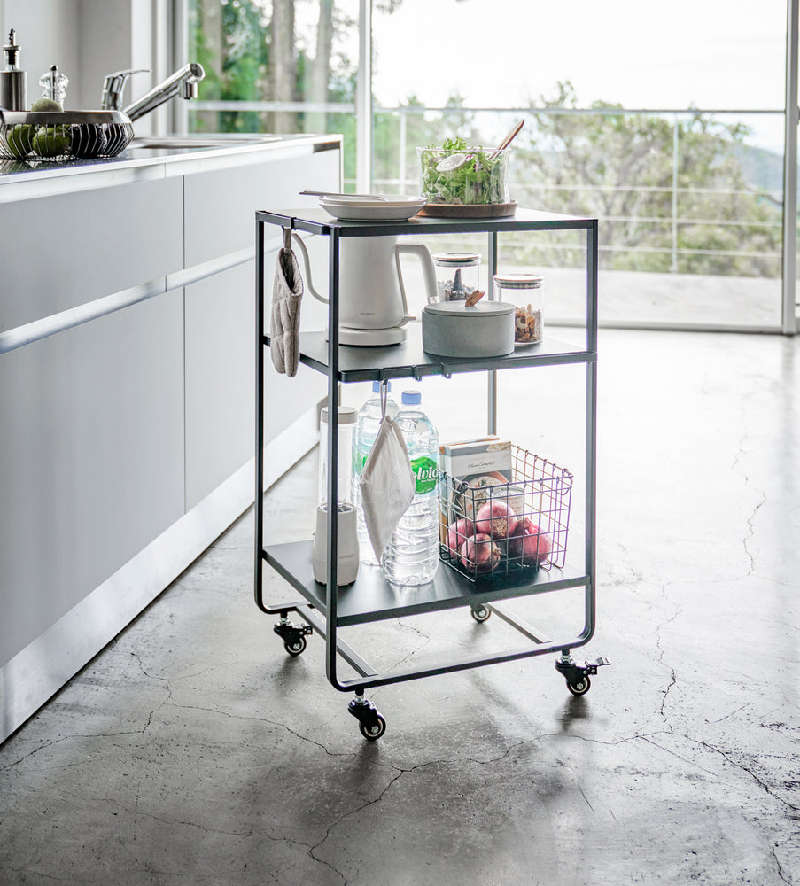 View 8 - Black Rolling Utility Cart displaying kitchen items in kitchen by Yamazaki Home.