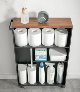Front view of black Rolling Storage Cart holding bathroom supplies by Yamazaki Home. view 12