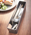 Black Utensil Case holding utensils and items on tabletop by Yamazaki Home.