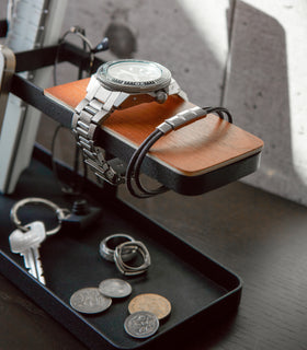 Close up end view of black Desk Organizer holding watch and keys by Yamazaki Home. view 6