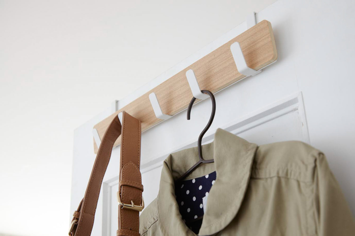 View 4 - Over-the-Door Hanger displaying jacket and bag by Yamazaki Home.