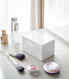 Closed white Skincare Organizer on vanity by Yamazaki Home. view 2