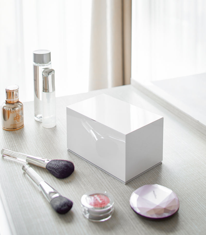 Closed white Skincare Organizer on vanity by Yamazaki Home.