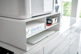 Close up view of white Rolling Printer Stand holding printing items by Yamazaki Home. view 4