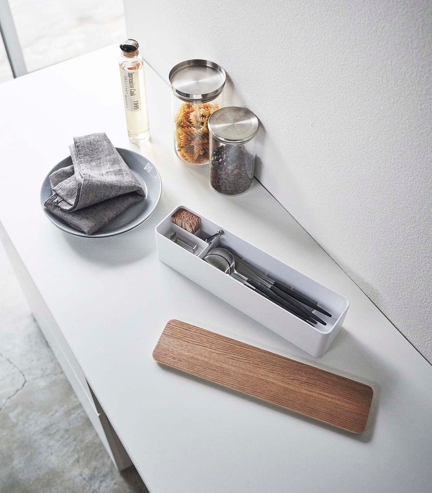 View 2 - White Utensil Case holding utensils on countertop by Yamazaki Home.