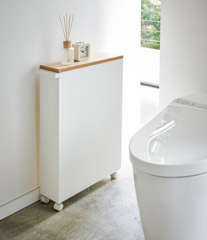 View 3 - Back view of white Rolling Storage Cart in bathroom by Yamazaki Home.