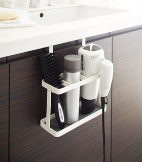 White Hair Tool and Styling Accessory Organizer holding hair products and tools in bathroom by Yamazaki Home. view 4
