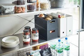 Black Stackable Vegetable Stockers stacked and holding food items on kitchen pantry shelf by Yamazaki Home. view 11