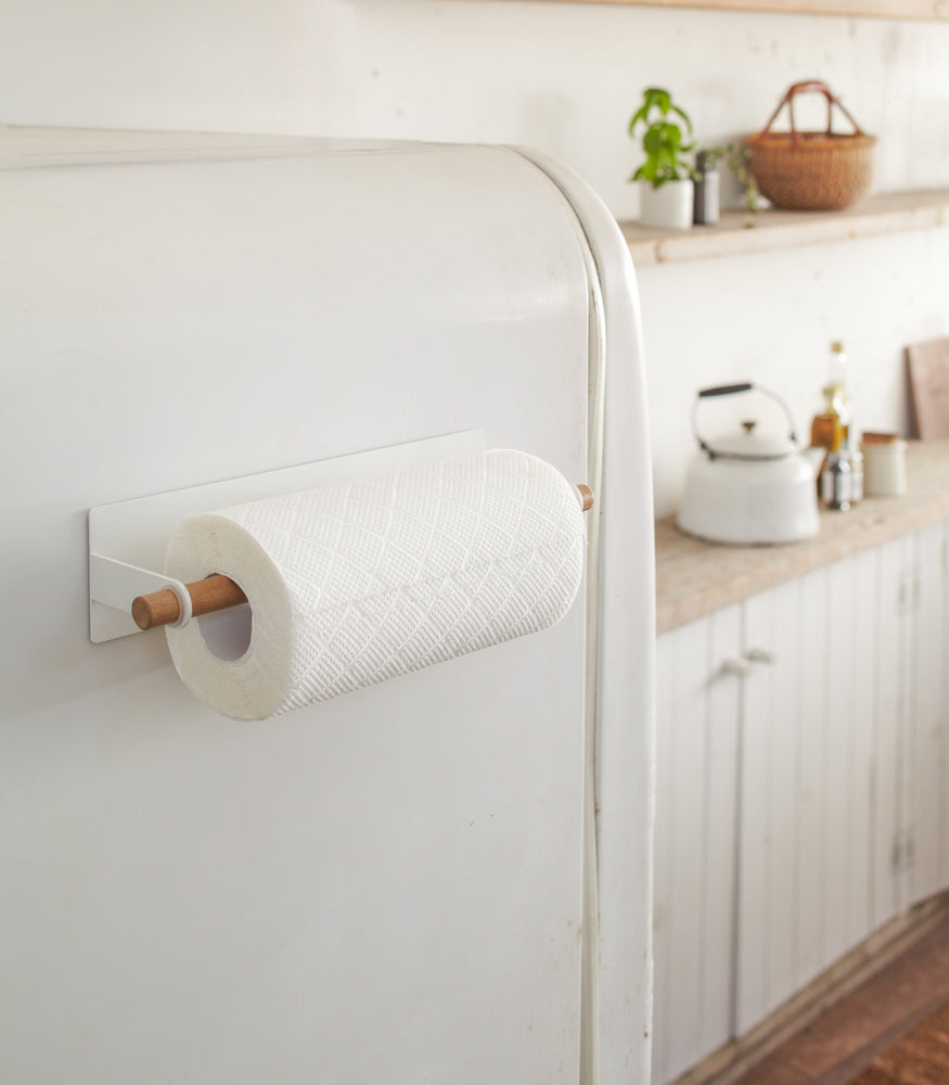 View 4 - Magnetic Paper Towel Hanger holding paper towel on kitchen fridge by Yamazaki Home.